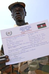 SPLA Soldier Displays Discharge Certificate